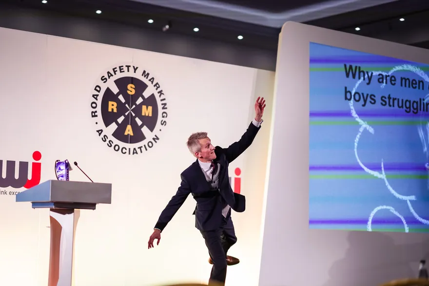 Andrew speaking on stage