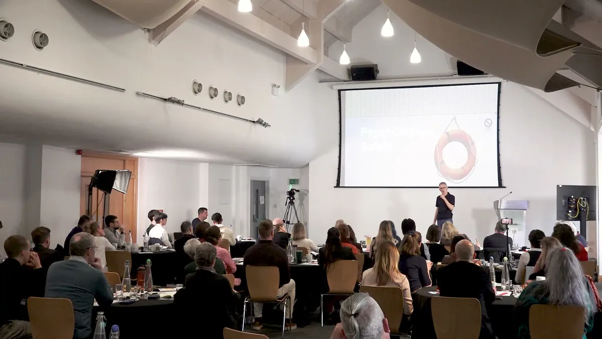 Andrew delivering a session to a full room