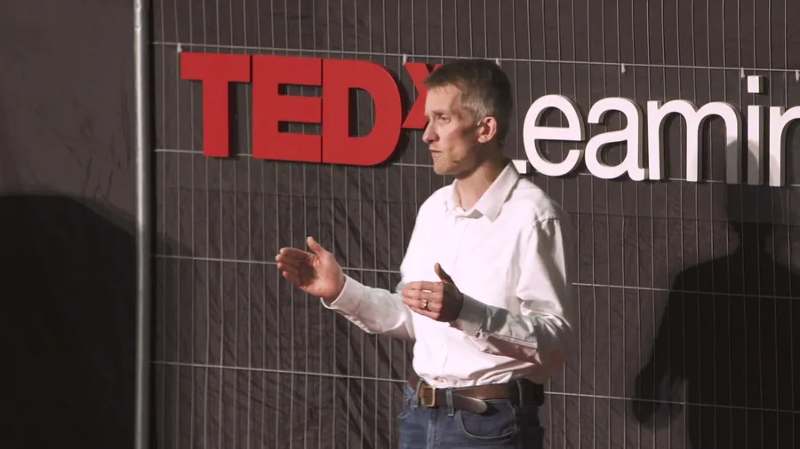Andrew Pain delivering a keynote on stage